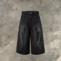 Men's black denim shorts with flame embroidery patch detail on straight leg cropped design