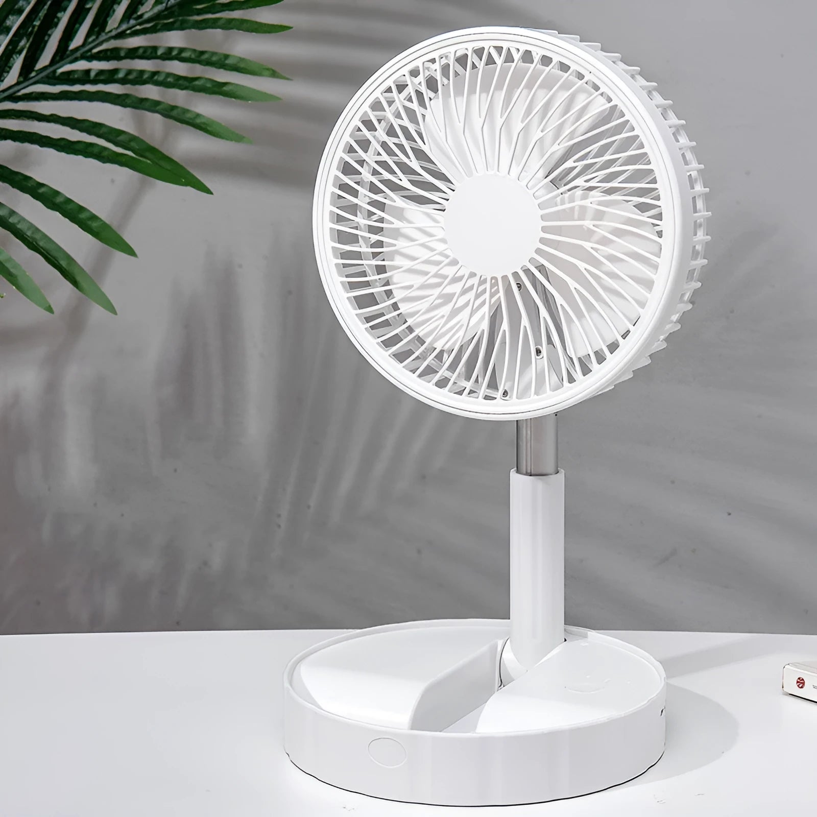 Black portable telescopic folding fan extended to full height showing oscillation function and power bank port