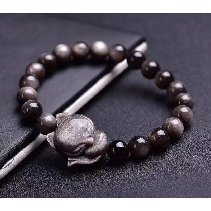 Obsidian fox single ring bracelet with 8mm black stone bead and silver charm on elastic cord.