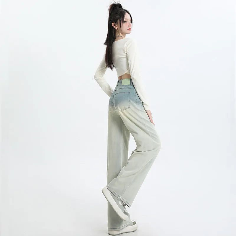 Women's gradient blue wide leg straight-leg denim trousers laid flat.