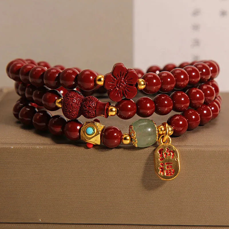 6mm cinnabar bracelet with multi-circle gourd and five petal flower Chinese design in polished finish