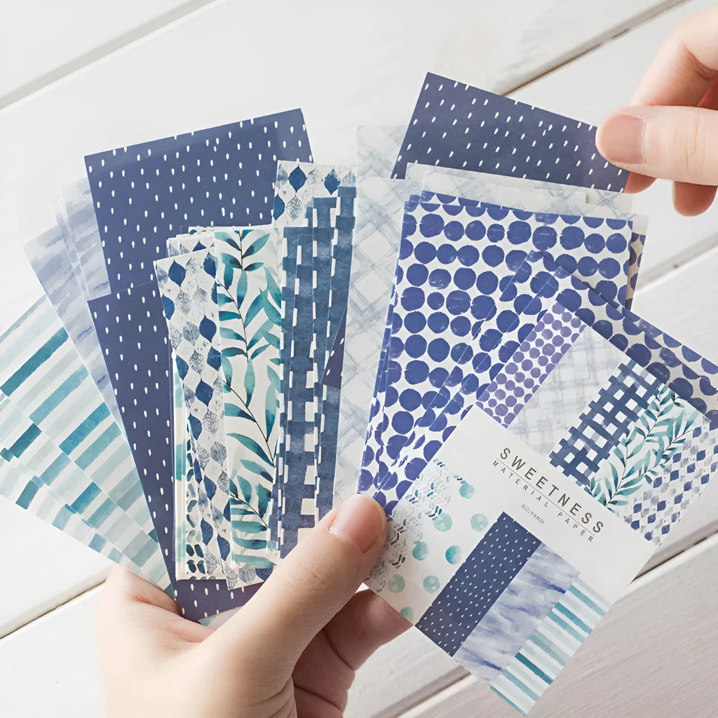 Pack of 50 retro collage note papers in ten dessert colours, each sheet sized 56mm by 83mm.