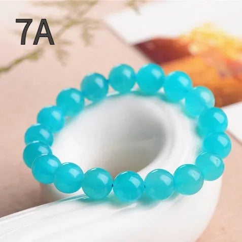 Natural Grade 7A Amazonite scattered beads in ice colour, showing polished surfaces and multiple size options for jewellery making.