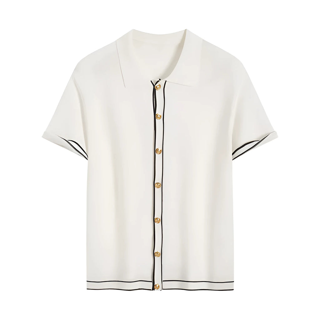 White short sleeve cardigan with dark contrast colour lapels, laid flat to show relaxed fit and button front.