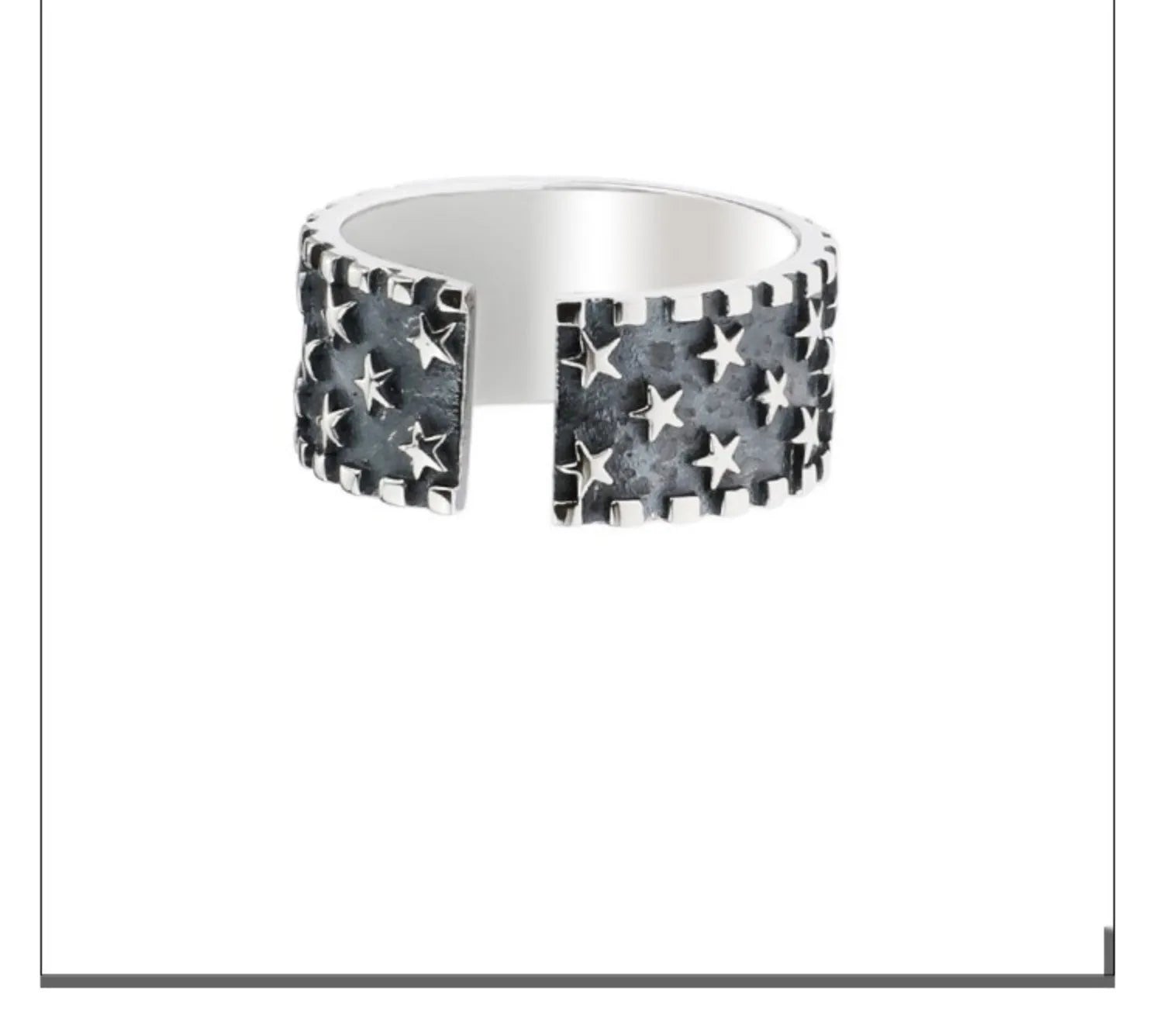 Adjustable open-back sterling silver ring with a geometric five-pointed star pattern.
