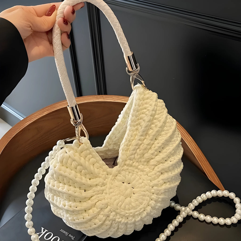 Handmade woven cloth bag in retro style with open pocket and double shoulder straps.