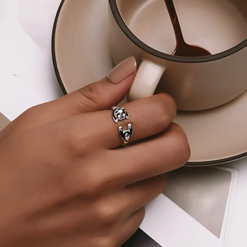 Cute Panda adjustable open ring in sterling silver with white gold plating on a finger.