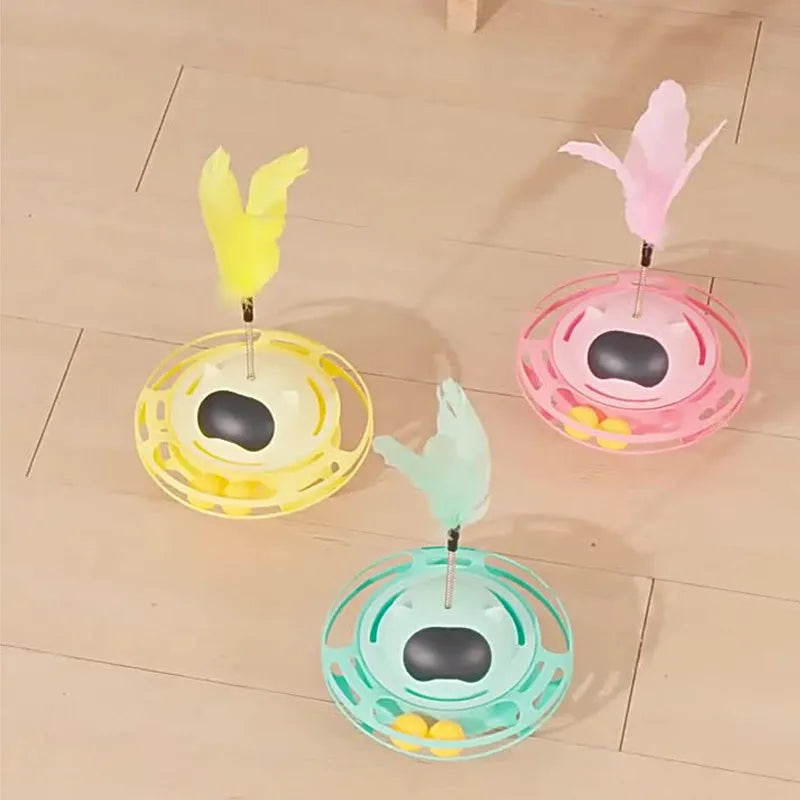 Pink cat tumbler turntable toy on a floor for feline self-play