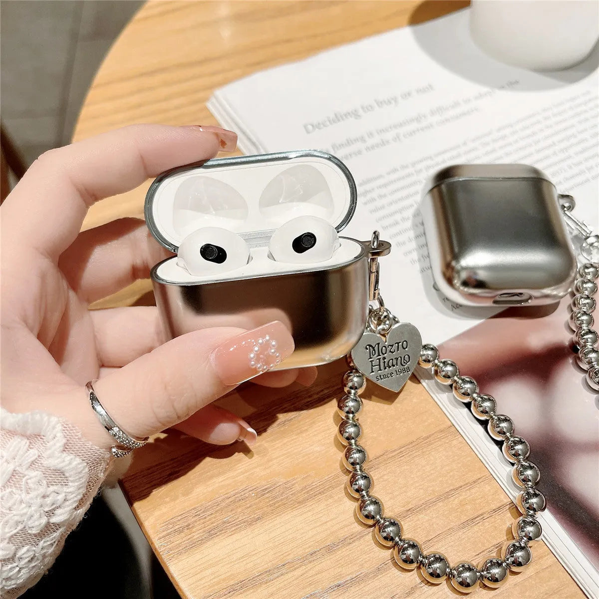 Matte plating TPU protective case for AirPods Bluetooth headsets on a plain background.