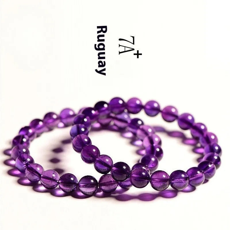 Natural amethyst Uruguay bracelet with polished purple beads, shown in single circle and triple ring designs.