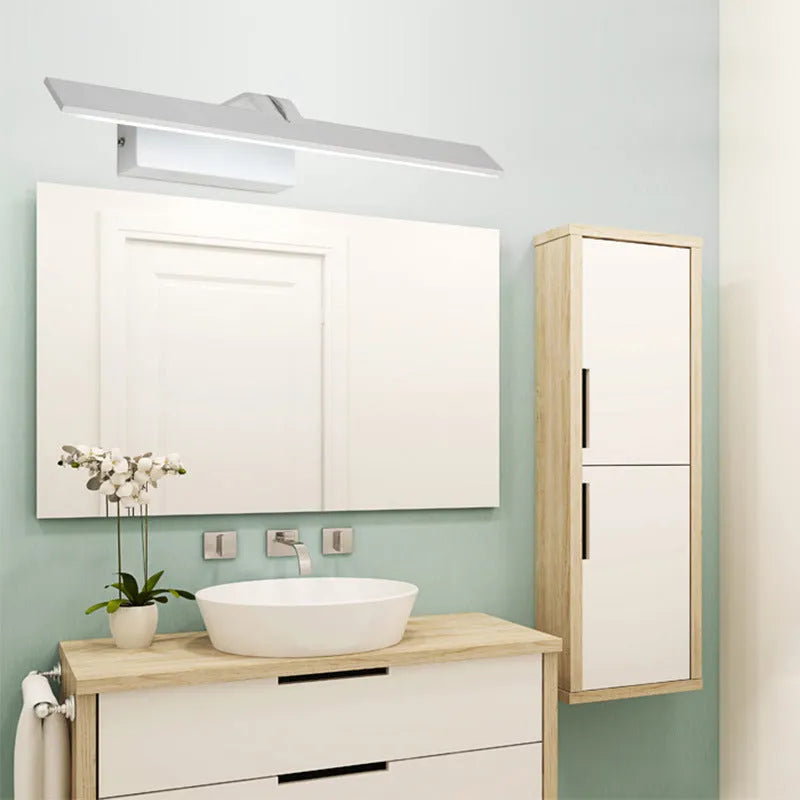 White LED illuminated bathroom mirror headlight mounted on wall, showing even light distribution across its length.