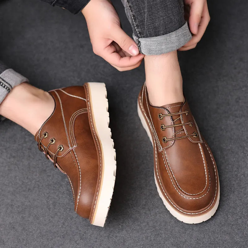 Men's black retro low-top casual worker boots with a rounded toe and rubber sole.