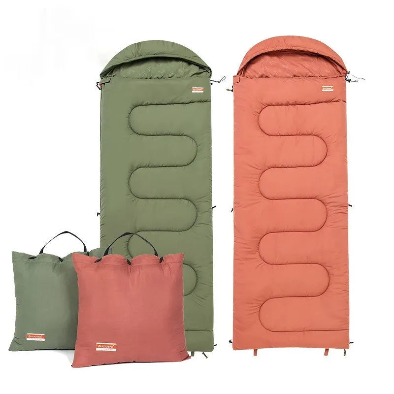 Ochre and olive green portable cotton camping sleeping bag with carry case.