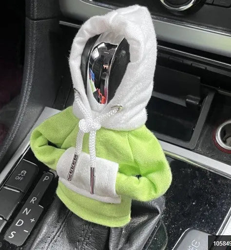 Red and white polyester car gear lever hood cover on a black gear stick.
