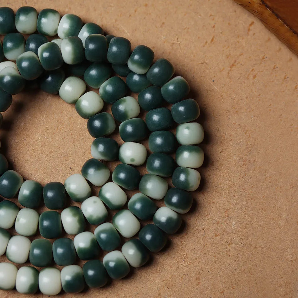 Lotus White Jade Bodhi Beads Bracelet showing floating flowers pattern on Bodhi root beads