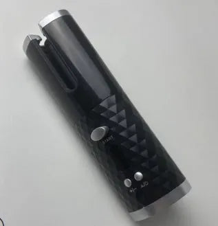 A white portable automatic wireless curling iron with a USB cable and a gold ceramic barrel.