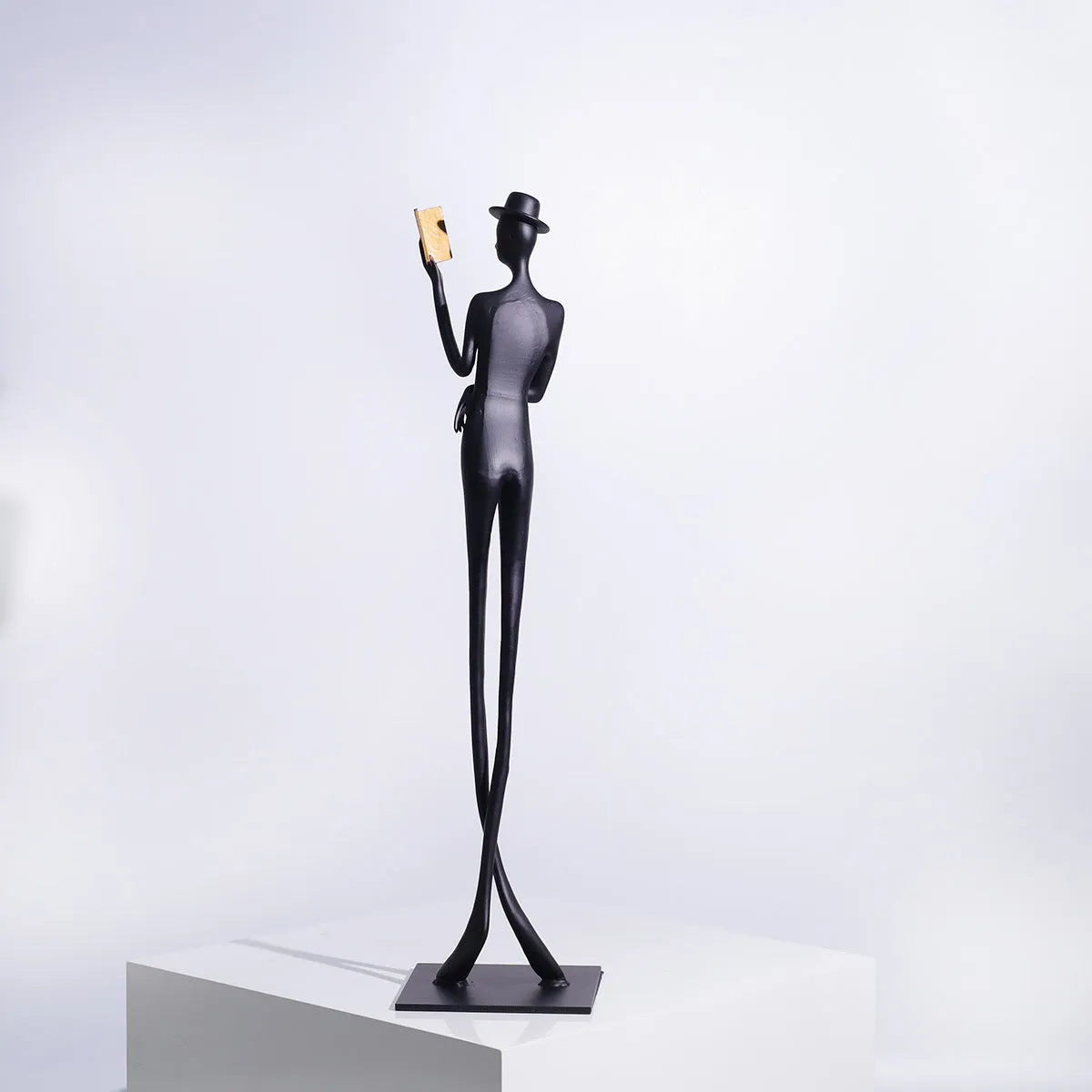 Black cast aluminium reading woman desktop sculpture modern minimalist design 51cm tall