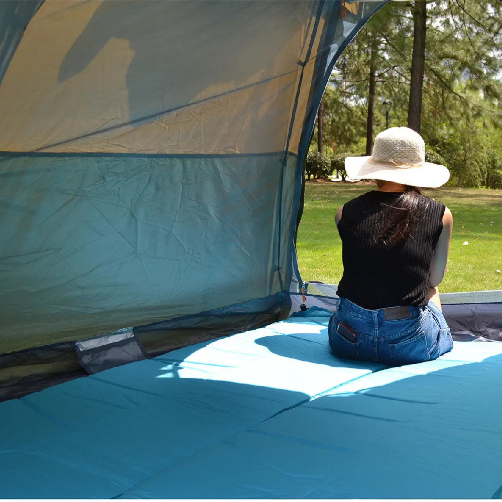 Khaki fully automatic hexagonal camping tent for 5-8 people with rain cover and two entry gates set up outdoors