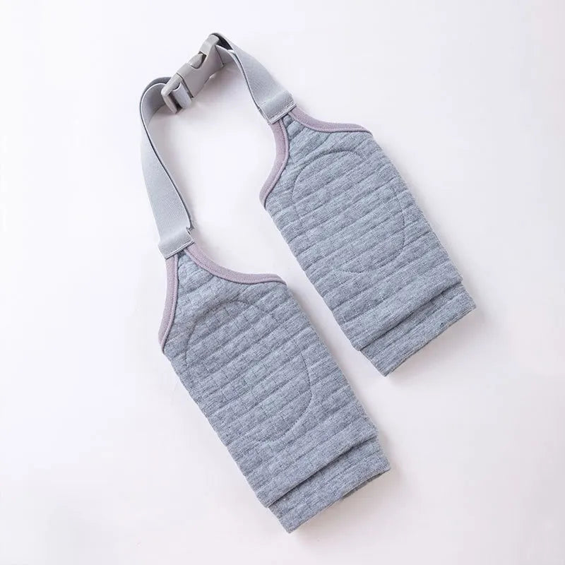 Blue dog elbow support sleeve with padded patch and matching scarf, shown with plastic buckle adjustment.
