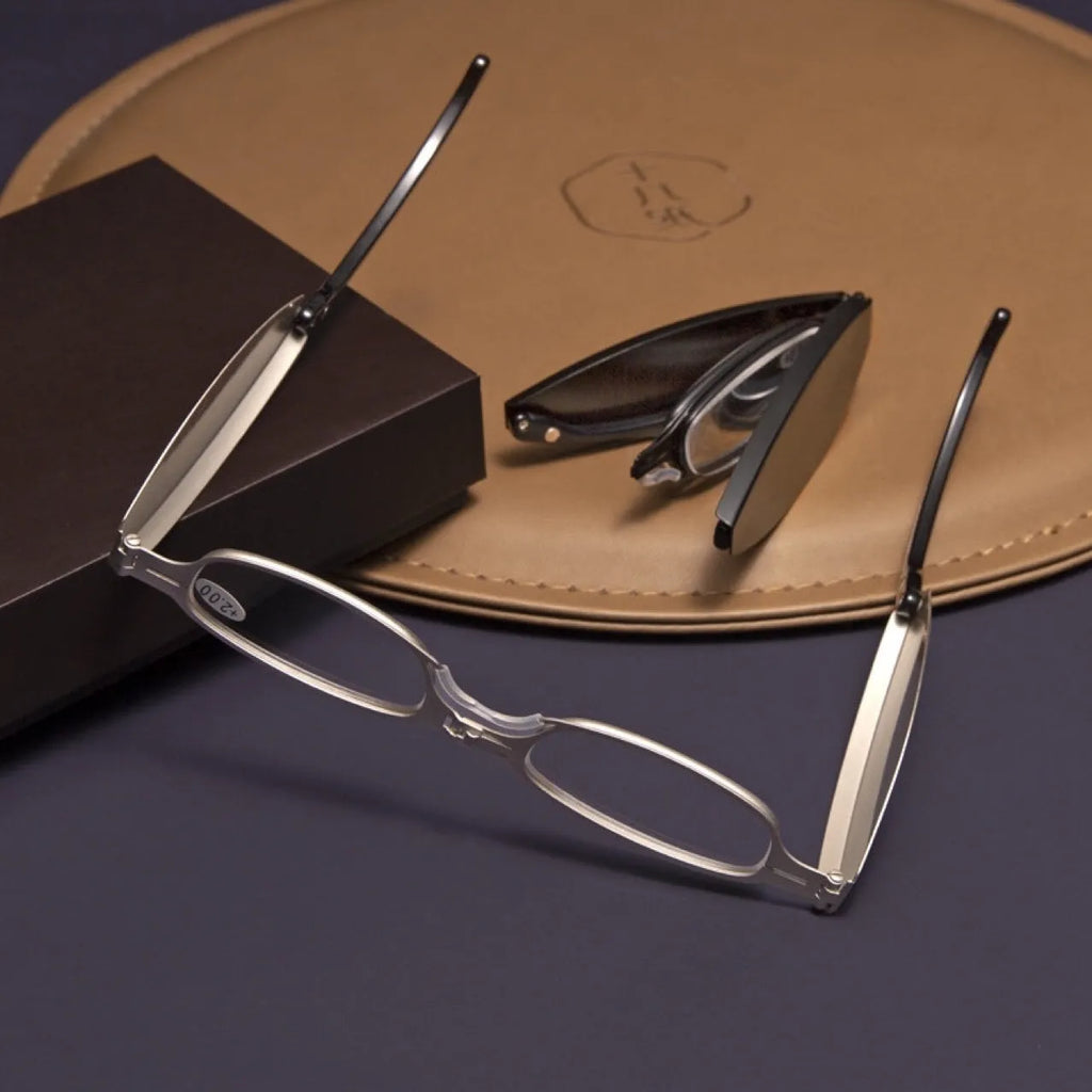 Folding presbyopic glasses in black retro frame showing folded and open positions