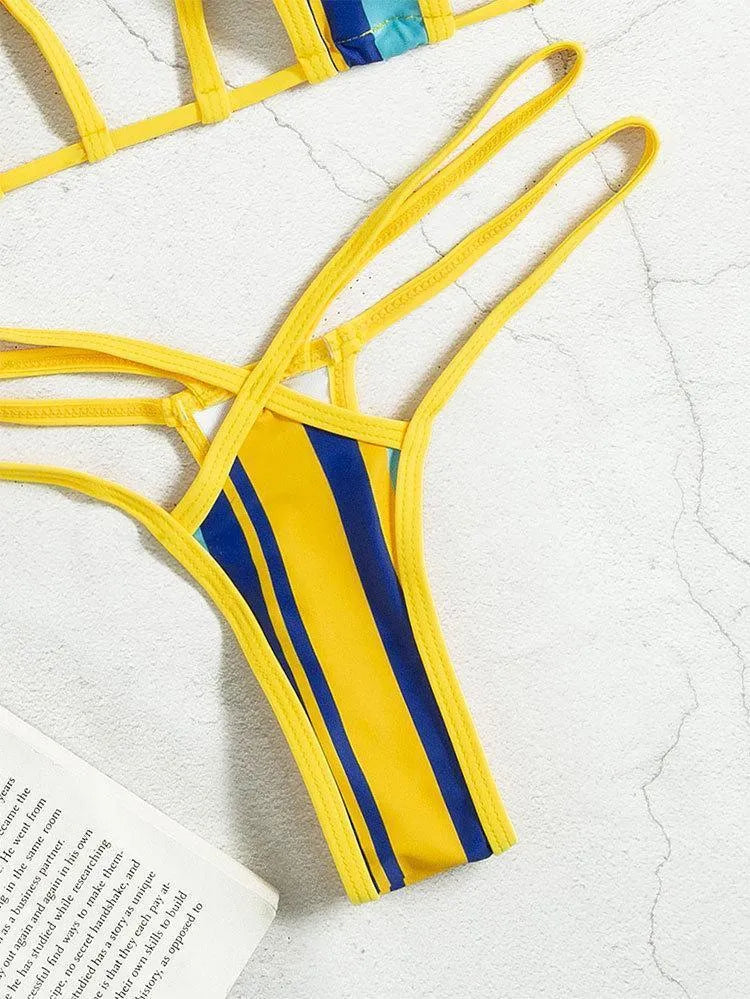 Yellow women's split swimsuit with neck-hanging design, high-waisted shorts, and sleeveless backless top