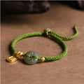 Green rope bracelet with Hetian jade peace buckle fastener, traditional Chinese hand-woven construction