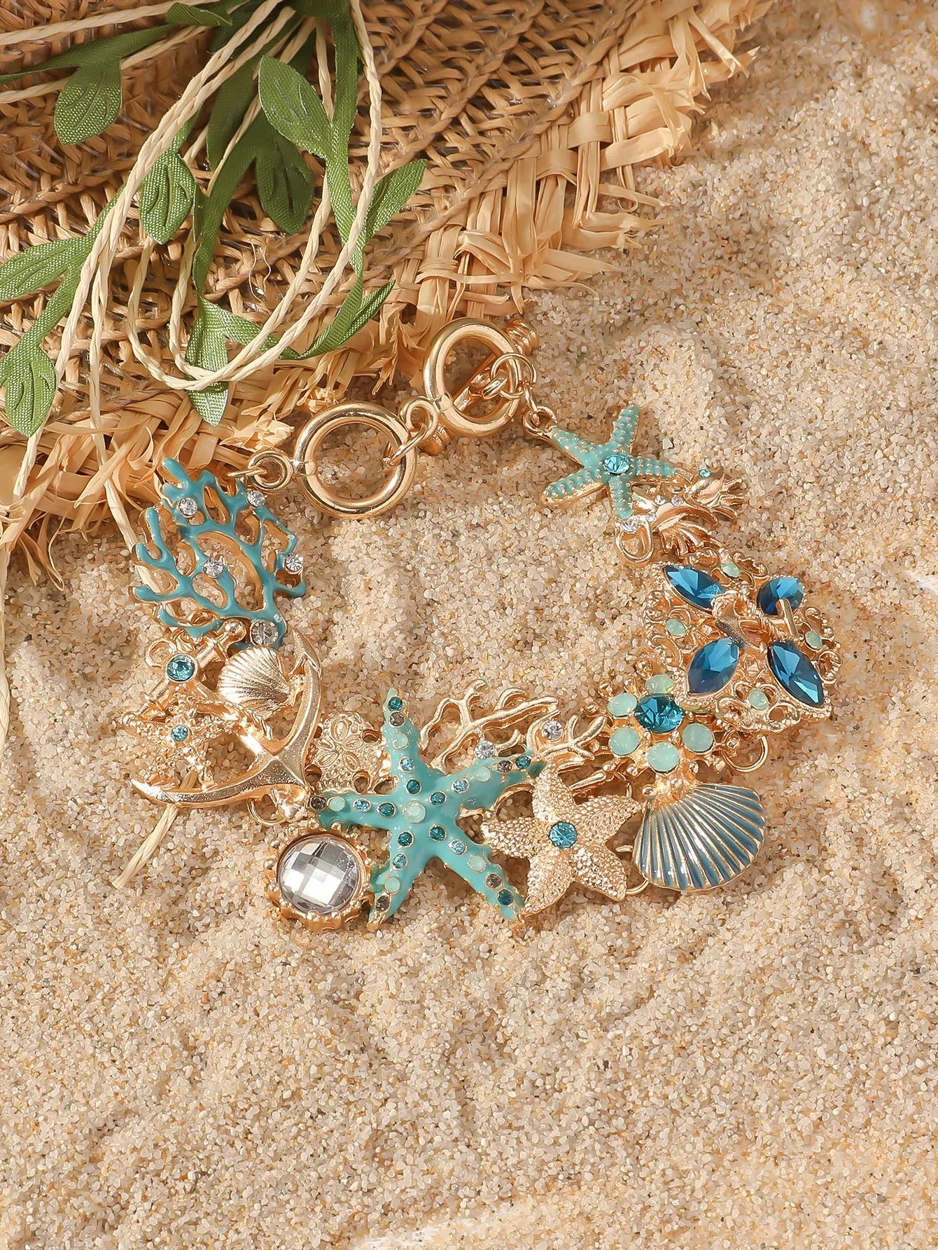 Alloy boat anchor and starfish rhinestone bracelet for women in turquoise, coral red, or coral blue.