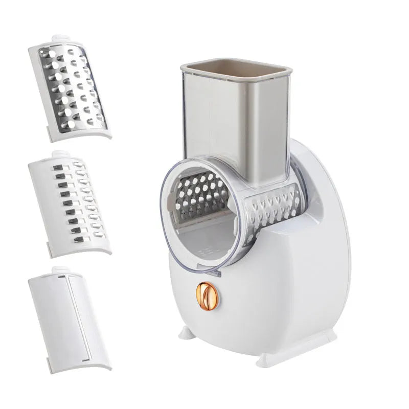 White electric vegetable slicer with rotary grater and suction base on a kitchen counter.