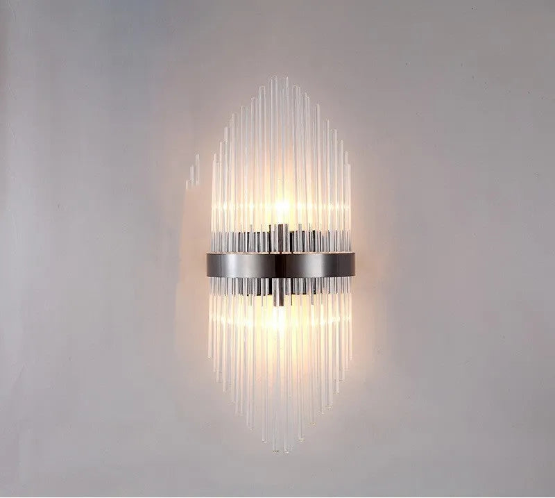 Modern crystal wall lamp with petal design and titanium gold finish mounted on wall