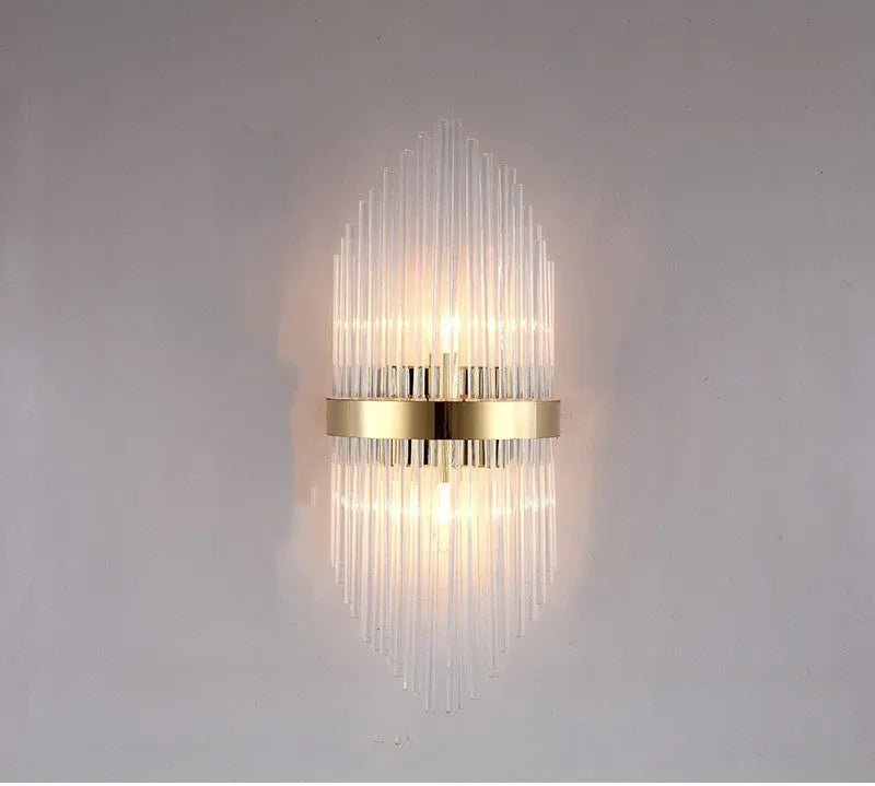 Modern crystal wall lamp with petal design and titanium gold finish mounted on wall
