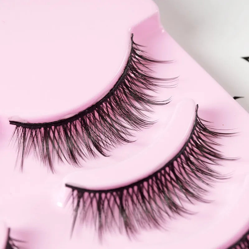 Set of manga style false eyelashes showing three wispy designs on a plastic black terrier base.