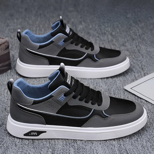 Men's low-top beige canvas board shoes with leather stitching details on a white background.