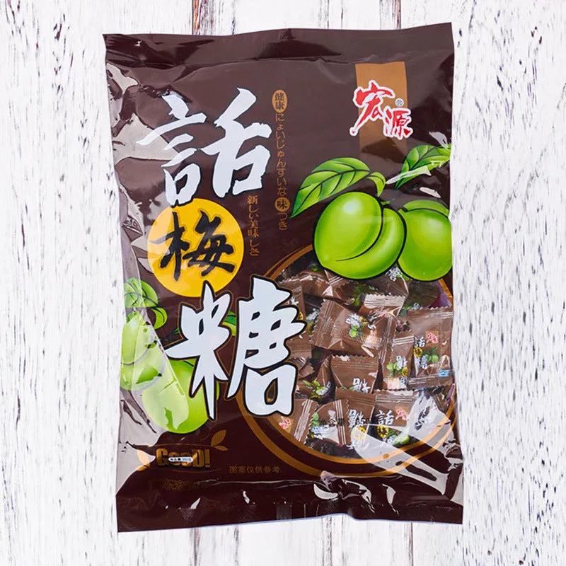 Assortment of Chinese fruit hard candies: plum sugar, guava and tangerine peel flavours in separate packets.