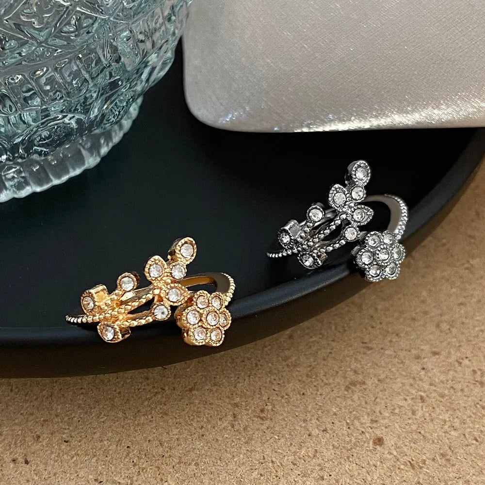 Copper open ring with flower and leaf design in gold or white diamond-treated finish