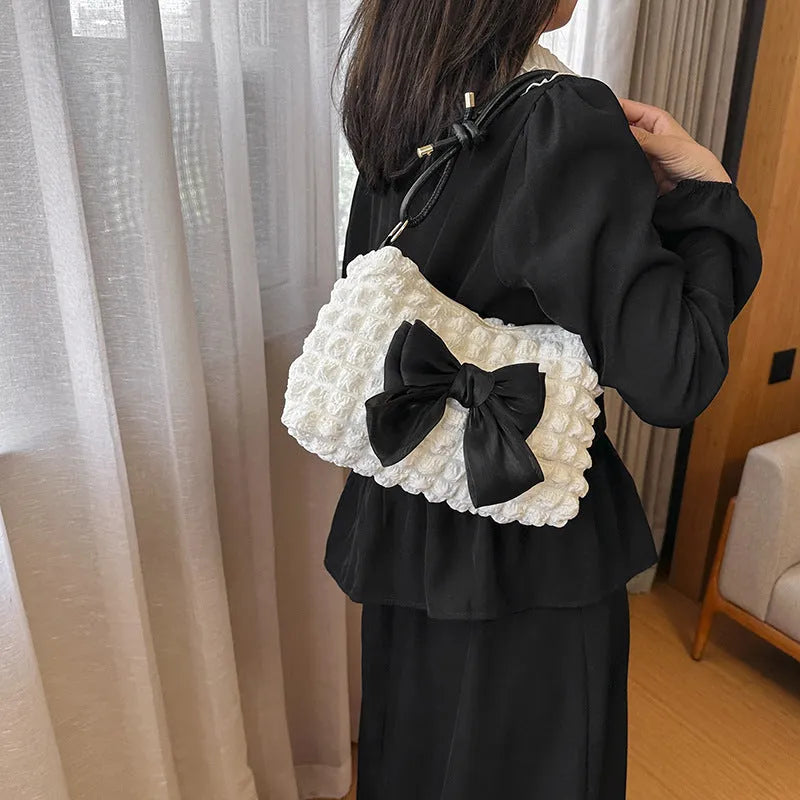 Women's canvas one-shoulder handbag in horizontal square shape with sandwich pocket, shown in black colour