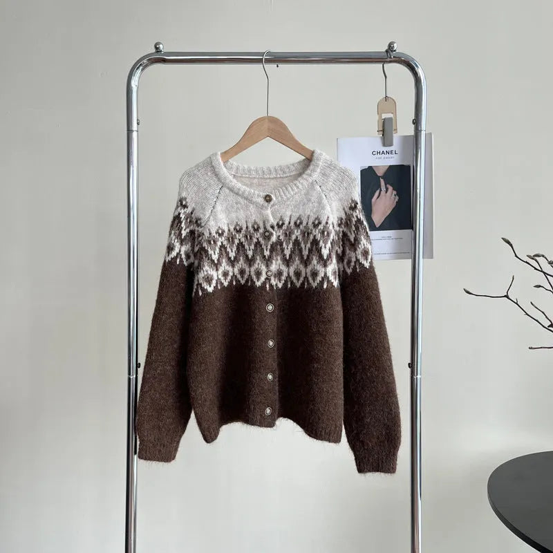 Women's loose fit jacquard knit sweater coat in contrast colours, showing long sleeves and textured pattern.
