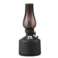 Kerosene lamp ultrasonic humidifier with grey ABS shell on a wooden desk showing single fog outlet