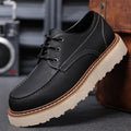 Men's black retro low-top casual worker boots with a rounded toe and rubber sole.
