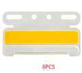 Aluminium alloy COB LED truck side light projecting bright white light onto ground next to tyre.