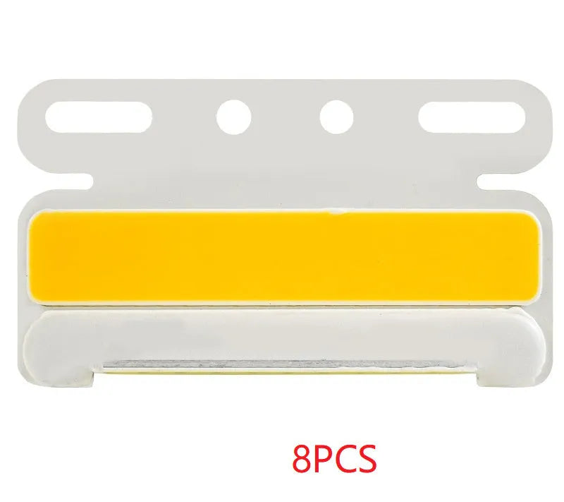 Aluminium alloy COB LED truck side light projecting bright white light onto ground next to tyre.