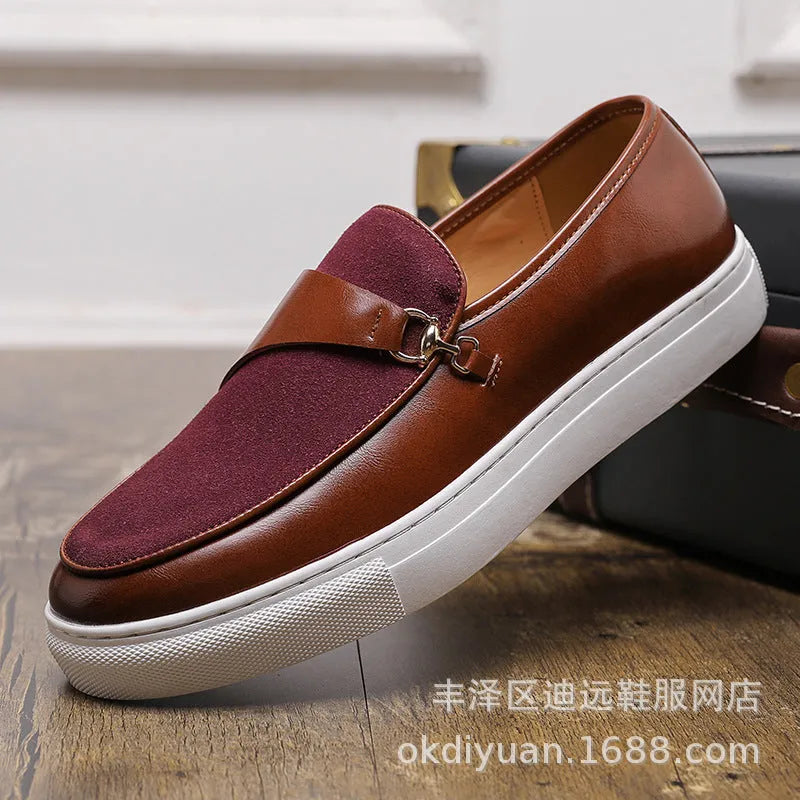Men's black faux leather slip-on loafers featuring a gold horsebit buckle and a round toe.