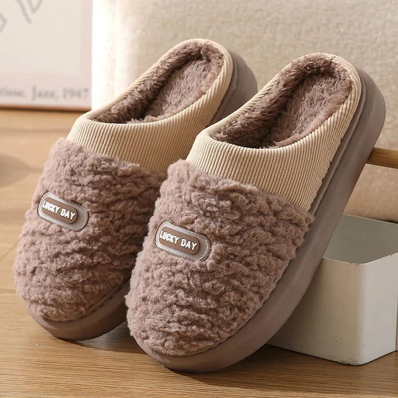 Men's grey and brown plaid winter slippers with a thick sole and rabbit hair trim.