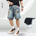 Men's blue ripped jeans shorts with straight leg cut, zipper fly, and graffiti detailing