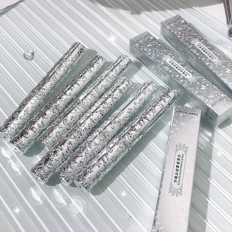 Velvet Mist Lip Mud Matte Lipstick tube showing six shade options from rose to brown.