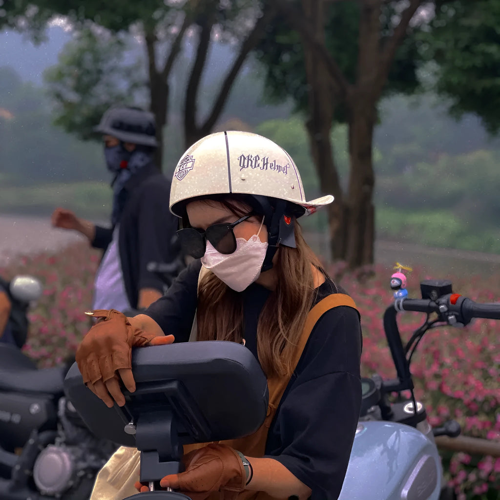 Men's bright black retro half helmet for electric bicycles with a gradient blue visor lens.