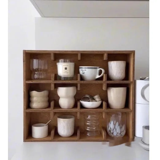 Solid birch wood cup storage rack with square compartments organising mugs on kitchen counter