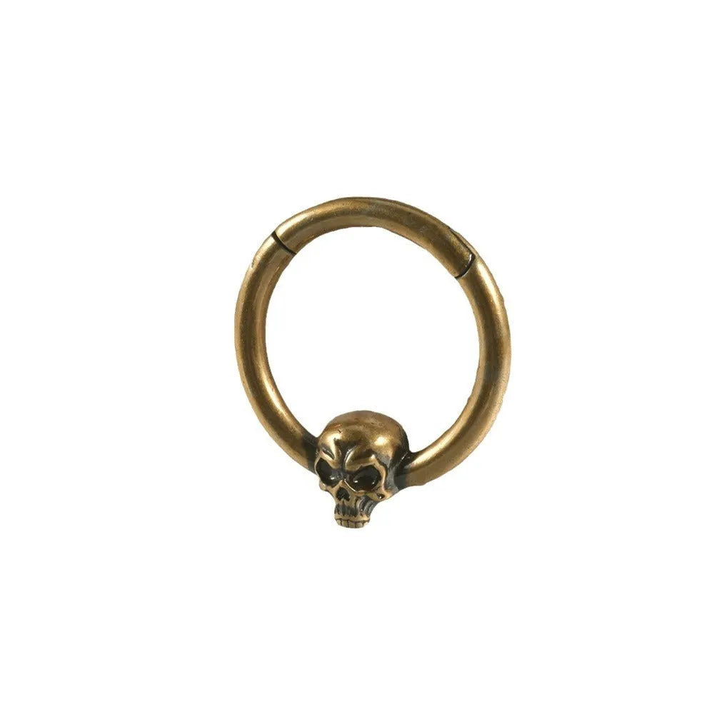 A pair of antique silver copper punk earrings featuring three small detailed ghost heads on a horizontal bar.