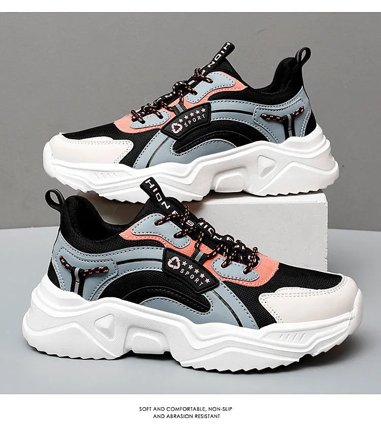 White women's casual sport shoes with a mesh upper, thick PU sole, buckle detail, and round toe.