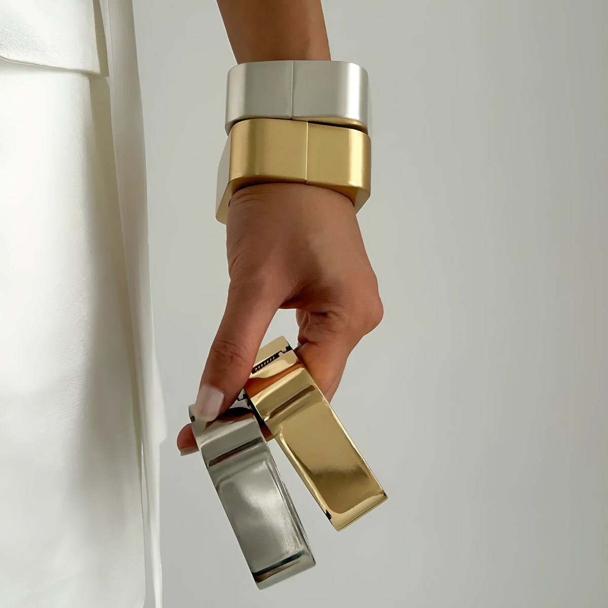 Geometric square mirror bracelet with glossy electroplated alloy finish in Gold or Silver Sweep colour