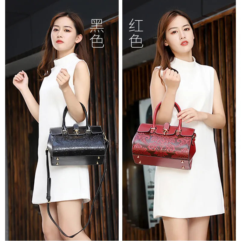 Women's vintage leather crossbody bag in red with embossing and multiple internal compartments